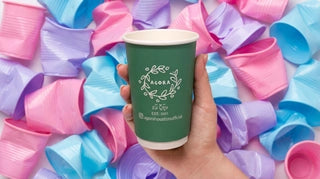 Green custom paper cup product photo against a colorful pastel backdrop
